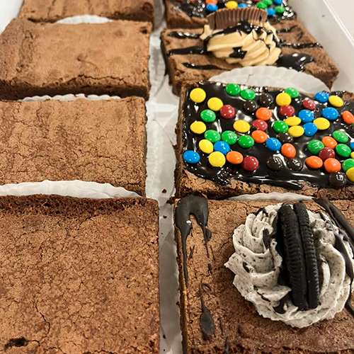 a variety of brownies including, plain, reeses peanut butter, oreo, m&m;s