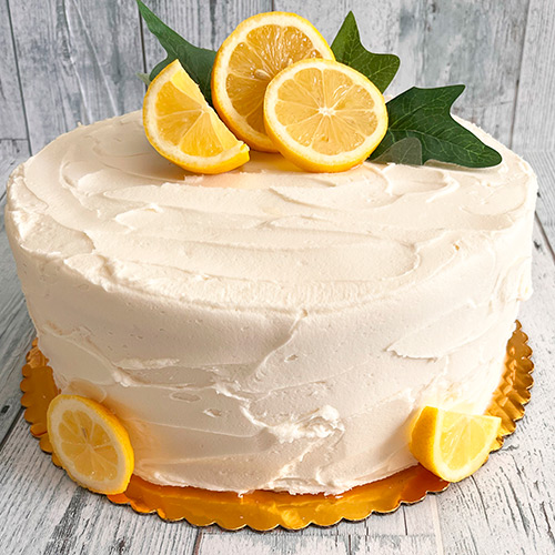 A cake topped with lemons