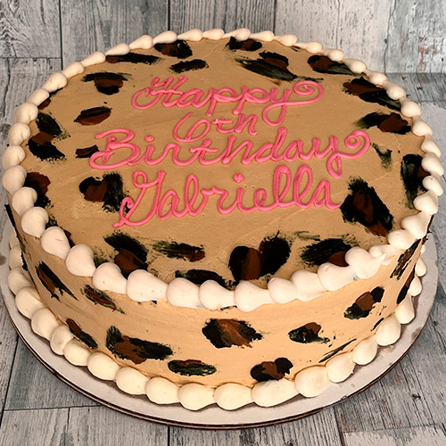 a leopard print birthday cake