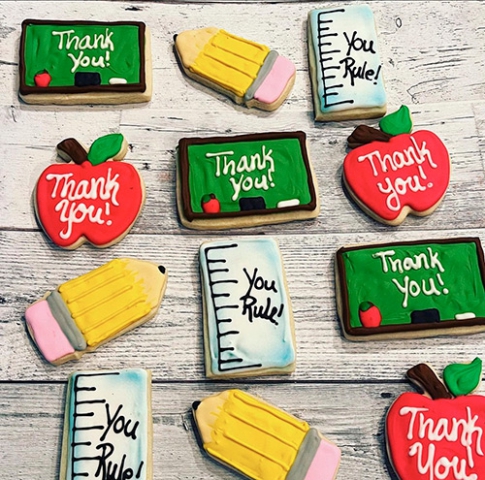 appreciation sugar cookies for teachers decorated and shaped like chalkboards, pencils and rulers