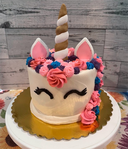 a round unicorn style cake
